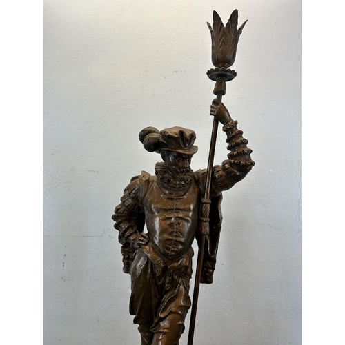 574 - A late 19th/early 20th century cast spelter cavalier statue on circular wooden base - approx. 75cm h... 