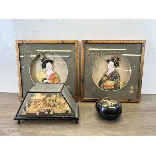 582 - Four Oriental items, two framed 3d Geisha girls with hand painted details, miniature carved cork dio... 