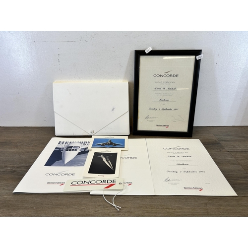 585 - A collection of Concorde ephemera to include flight menu, flight certificate, postcards etc.