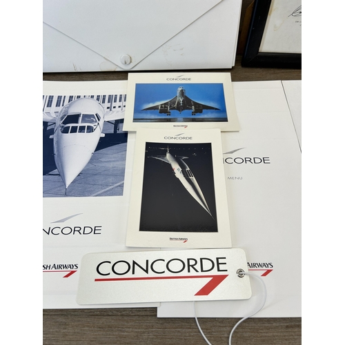 585 - A collection of Concorde ephemera to include flight menu, flight certificate, postcards etc.