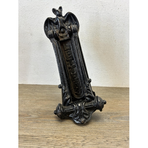 586 - A Victorian cast iron black painted bat design door knocker - approx. 23cm high