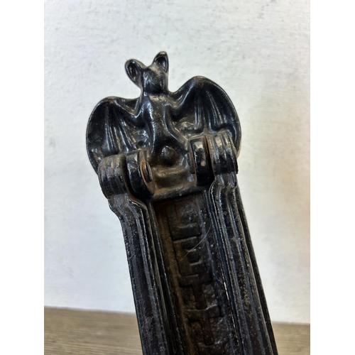 586 - A Victorian cast iron black painted bat design door knocker - approx. 23cm high