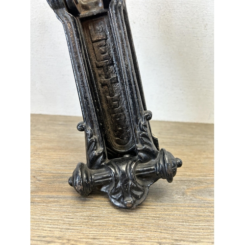 586 - A Victorian cast iron black painted bat design door knocker - approx. 23cm high