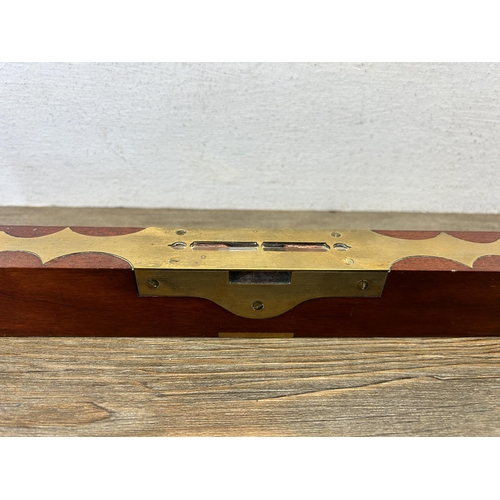 594 - A 19th century brass and mahogany spirit level - approx. 45cm long