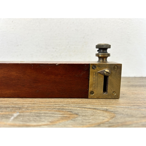 594 - A 19th century brass and mahogany spirit level - approx. 45cm long