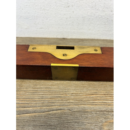 594 - A 19th century brass and mahogany spirit level - approx. 45cm long