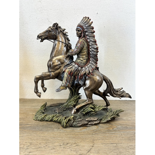 595 - A pair of Willow Hall Native American resin figurines - largest approx. 30cm high