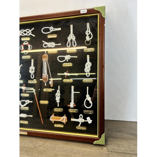 600 - A mahogany and brass framed Nautical knot board - approx. 53cm high x 74cm wide