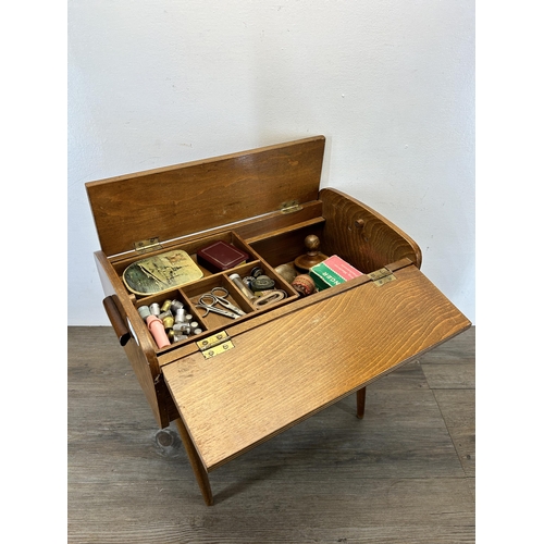 601 - A mid 20th century beech and plywood sewing box with contents - approx. 45.5cm high x 46cm wide x 28... 