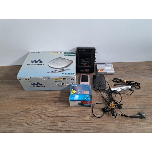 649 - A collection of Sony items to include boxed D-EJ835 CD Walkman, MZ-N1 MiniDisc Walkman with sealed b... 