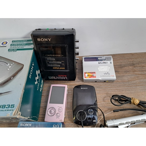 649 - A collection of Sony items to include boxed D-EJ835 CD Walkman, MZ-N1 MiniDisc Walkman with sealed b... 