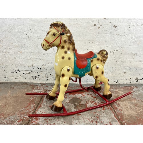 473 - A vintage tinplate rocking horse