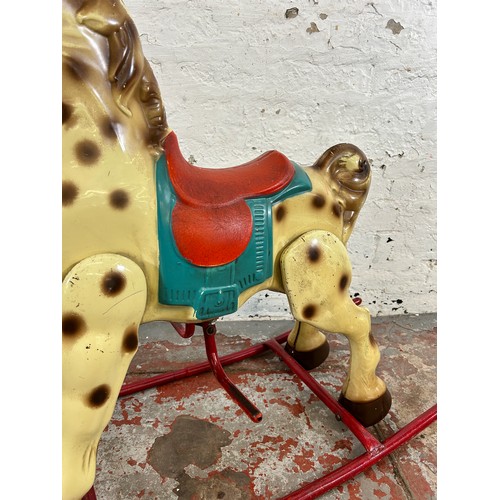 473 - A vintage tinplate rocking horse