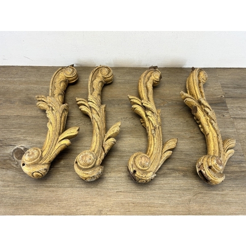 545 - Four Rococo gilded oak heavily carved brackets - approx. 40cm high