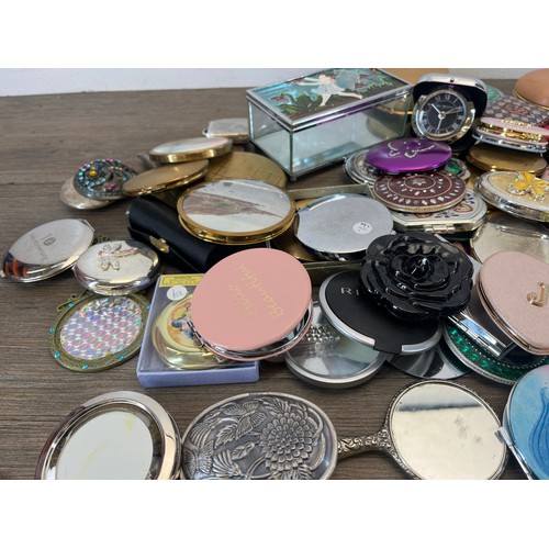 479 - A collection of compact mirrors and trinket boxes to include Stratton etc.