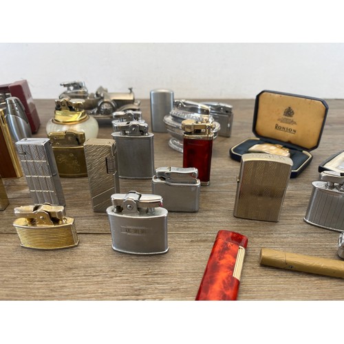 569 - A large collection of lighters to include Colibri, Ronson, Maruman etc.