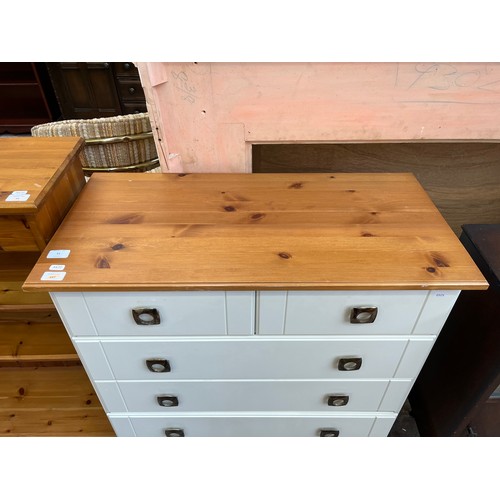 51 - A modern pine effect and white laminate chest of drawers - approx. 91cm high x 82cm wide x 40cm deep