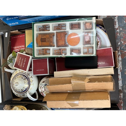 982 - Three boxes containing wooden dolls house furniture, ceramics, Timemaster quartz anniversary clock e... 