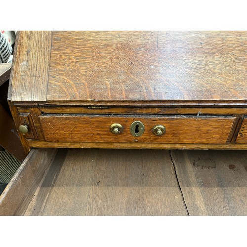 218 - A George III oak bureau