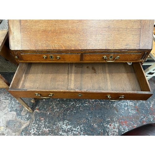 218 - A George III oak bureau