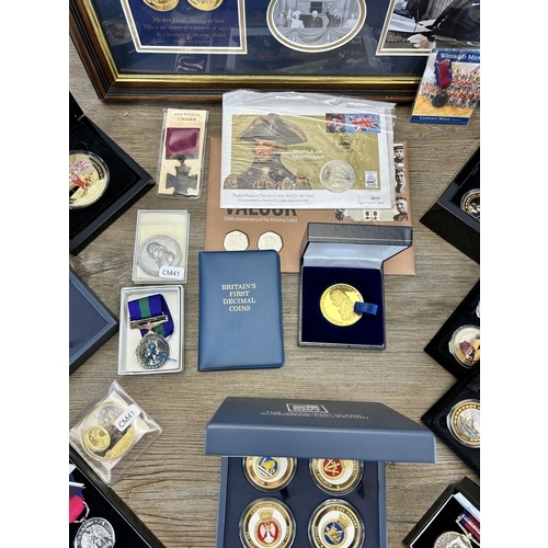 568 - A collection of coins and medals to include framed limited edition 009/299 'Victory in Europe 8th of... 