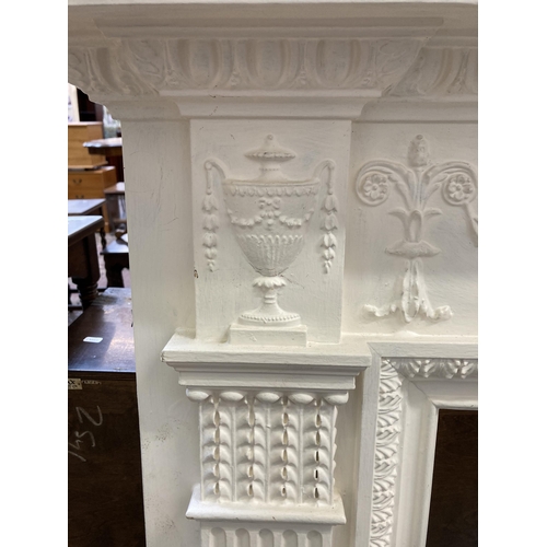 9 - A Victorian style white painted wooden fire surround - approx. 130cm high x 168cm wide x 20cm deep