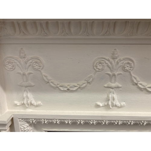 9 - A Victorian style white painted wooden fire surround - approx. 130cm high x 168cm wide x 20cm deep