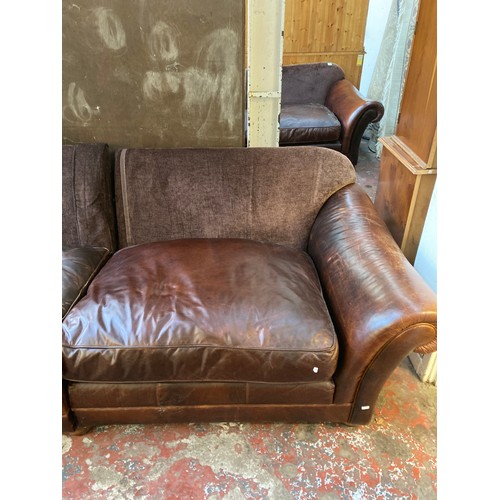 35 - A brown leather and fabric upholstered four seater sofa - approx. 79cm high x 252cm x 106cm