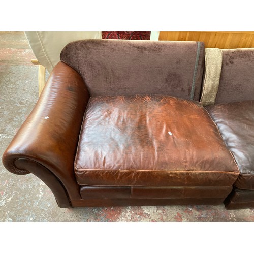 36 - A brown leather and fabric upholstered four seater sofa - approx. 79cm high x 252cm long x 106cm dee... 