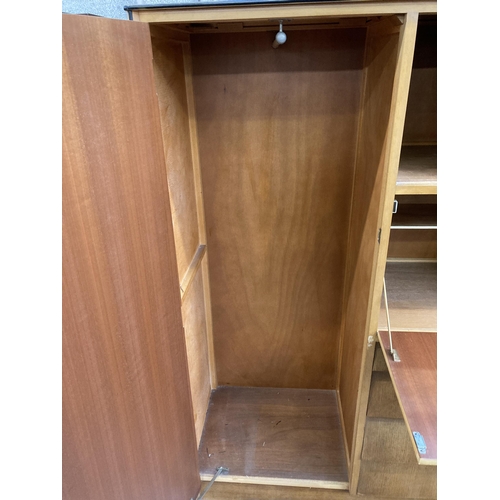 64 - A mid 20th century oak gentleman's wardrobe - approx. 152cm high x 102cm wide x 47cm deep