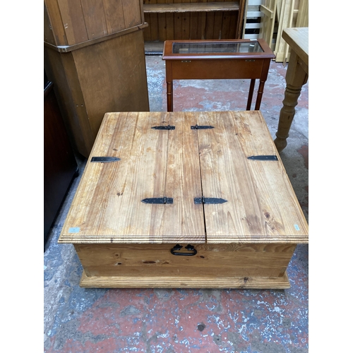 69 - A pine square storage coffee table - approx. 40cm high x 90cm square