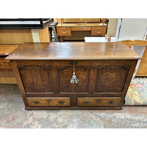 74 - A George III oak mule chest with two lower drawers - approx. 83cm high x 142cm wide x 55cm deep