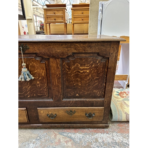 74 - A George III oak mule chest with two lower drawers - approx. 83cm high x 142cm wide x 55cm deep