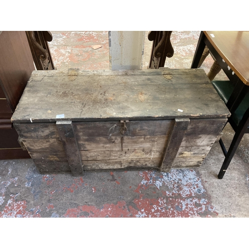 134 - An early 20th century pine tool box - approx. 54cm high x 109cm wide x 48cm deep