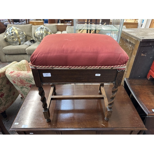 193 - A mid 20th century oak barley twist upholstered piano stool