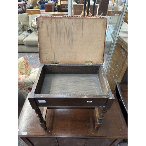 193 - A mid 20th century oak barley twist upholstered piano stool