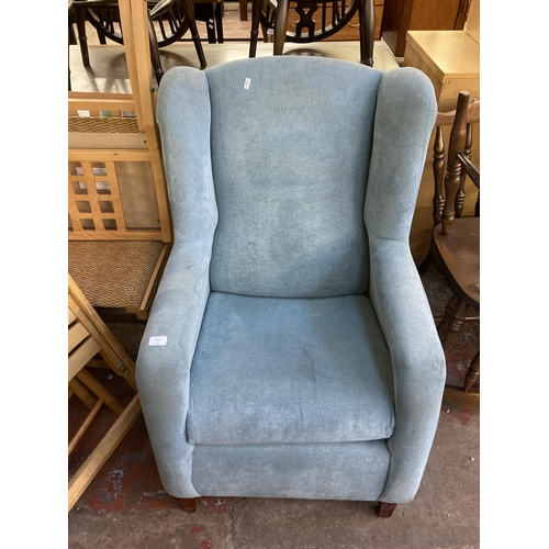 195 - A modern fabric upholstered wingback armchair