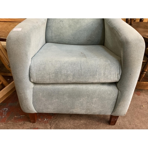 195 - A modern fabric upholstered wingback armchair