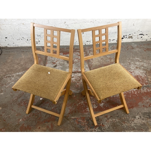 196 - Four beech folding chairs