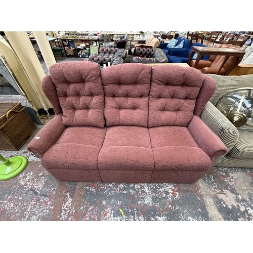 231 - A modern fabric upholstered three seater sofa