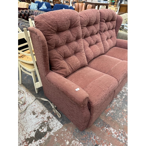 231 - A modern fabric upholstered three seater sofa