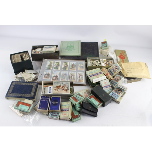 1094 - A large collection of vintage cigarette cards to include Players, Wills etc.