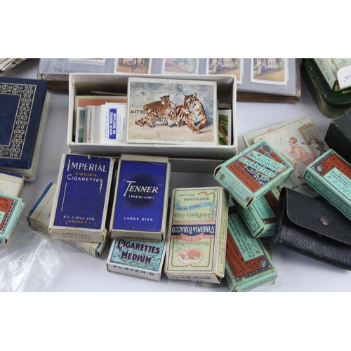 1094 - A large collection of vintage cigarette cards to include Players, Wills etc.