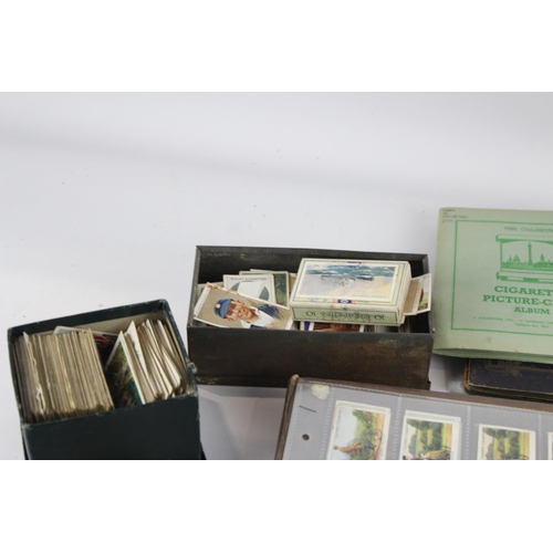 1094 - A large collection of vintage cigarette cards to include Players, Wills etc.