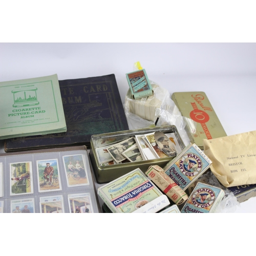 1094 - A large collection of vintage cigarette cards to include Players, Wills etc.