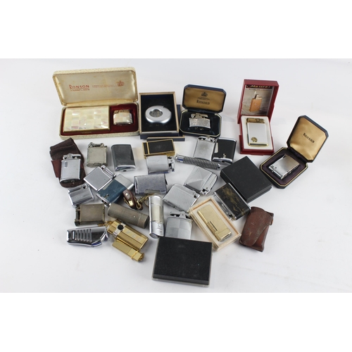 1121 - A large collection of vintage cigarette lighters to include Colibri, Zippo etc.