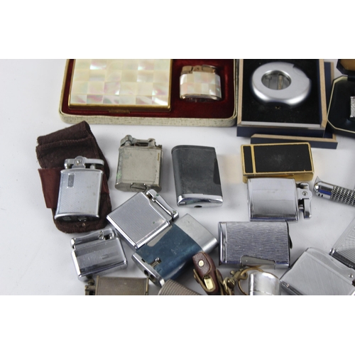 1121 - A large collection of vintage cigarette lighters to include Colibri, Zippo etc.