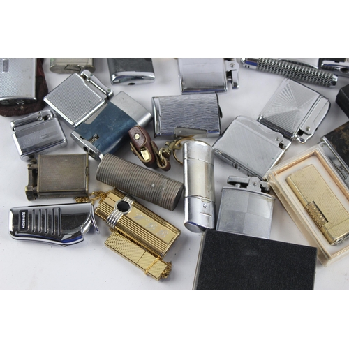 1121 - A large collection of vintage cigarette lighters to include Colibri, Zippo etc.