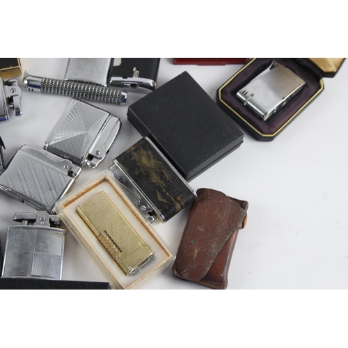 1121 - A large collection of vintage cigarette lighters to include Colibri, Zippo etc.