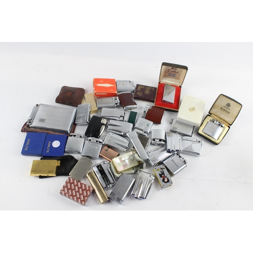 1122 - A large collection of vintage cigarette lighters to include Ronson etc.